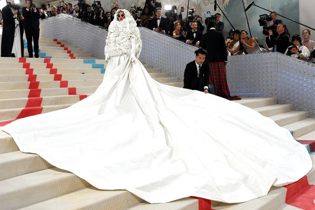 Pregnant Rihanna Blooms in Valentino Dress on Met Gala Red Carpet 2023 –  Footwear News