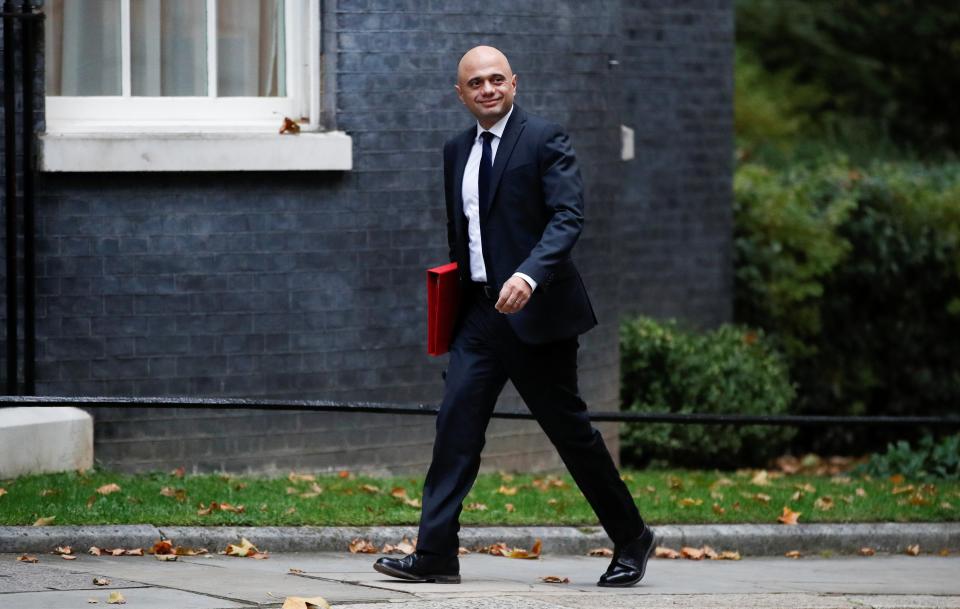 Health Secretary Sajid Javid walks outside Downing Street (REUTERS)