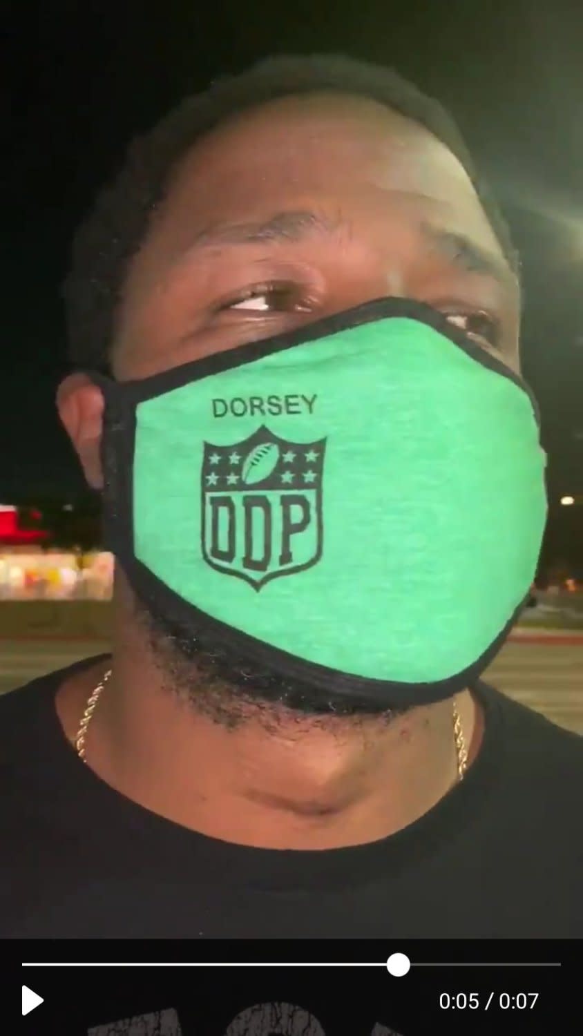 Coach Stafon Johnson models the Dorsey Dons mask