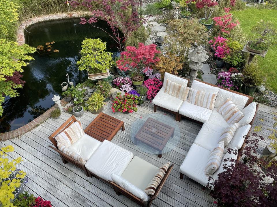 outdoor lounging area with koi pond