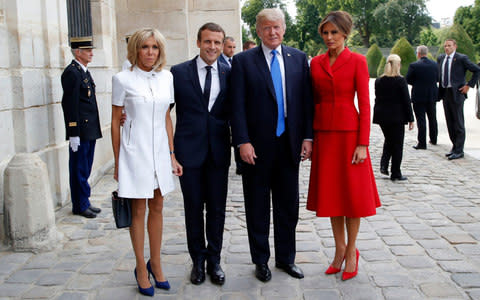 French President Emmanuel Macron, second left, his wife Brigitte, left, pose with U.S President Donald Trump and First Lady Melania Trump at Les Invalides museum in Paris - Credit:  Michel Euler/AP