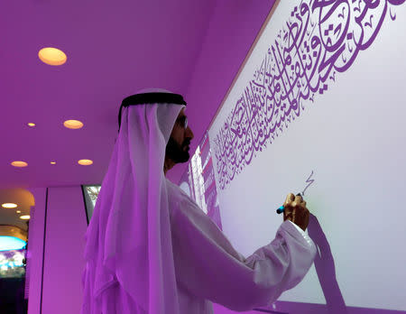 Sheikh Mohammed bin Rashid Al Maktoum, Vice-President and Prime Minister of the UAE and Ruler of Dubai, signs on the board during the official opening of the world's first functional 3D printed offices in Dubai May 23, 2016. REUTERS/Ahmed Jadallah