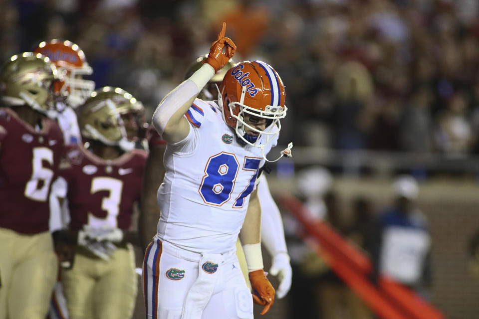 Florida tight end Jonathan Odom (87) celebrates his touchdown in the first quarter of an NCAA college football game against Florida State, Friday, Nov. 25, 2022, in Tallahassee, Fla. (AP Photo/Phil Sears)