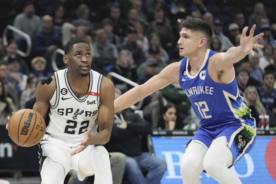 San Antonio Spurs' Malaki Branham tries to get by Milwaukee Bucks' Grayson Allen during the first half of an NBA basketball game Wednesday, March 22, 2023, in Milwaukee. (AP Photo/Morry Gash)