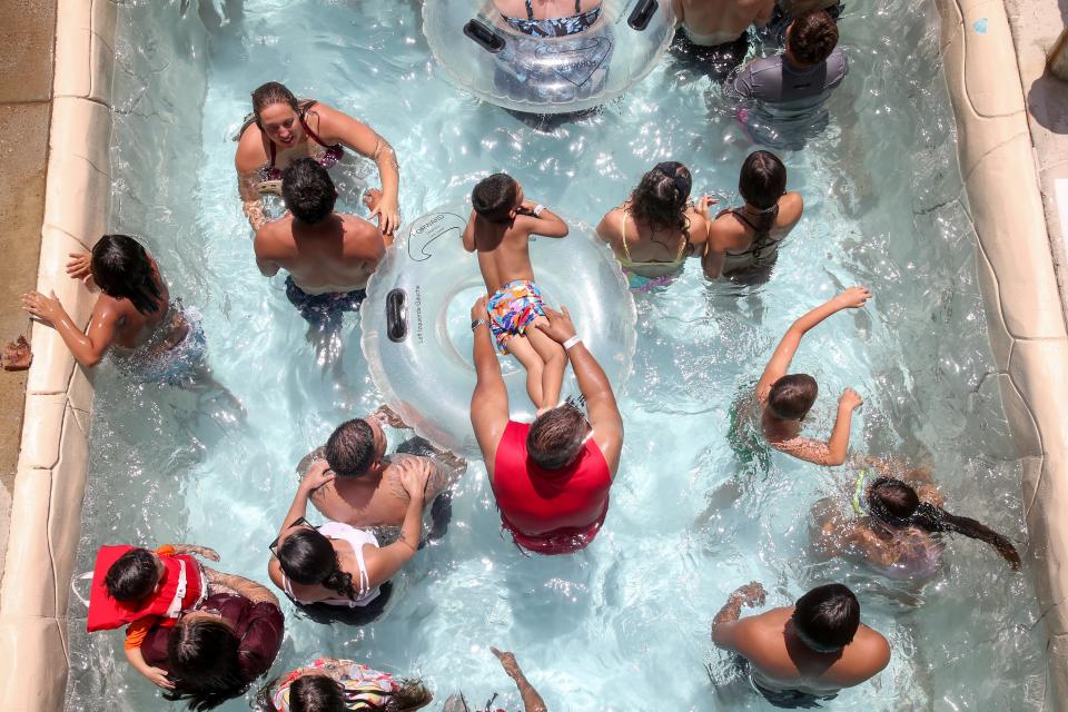 Guests relax in Hurricane Alley Waterpark's Gulf Stream Saturday, May 28, 2022.