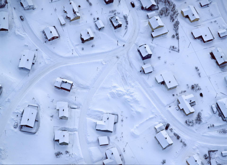 Snow covered roofs in Norway, which Jason Hawkes snapped during his 12-year project. Picture- Barcroft Media.