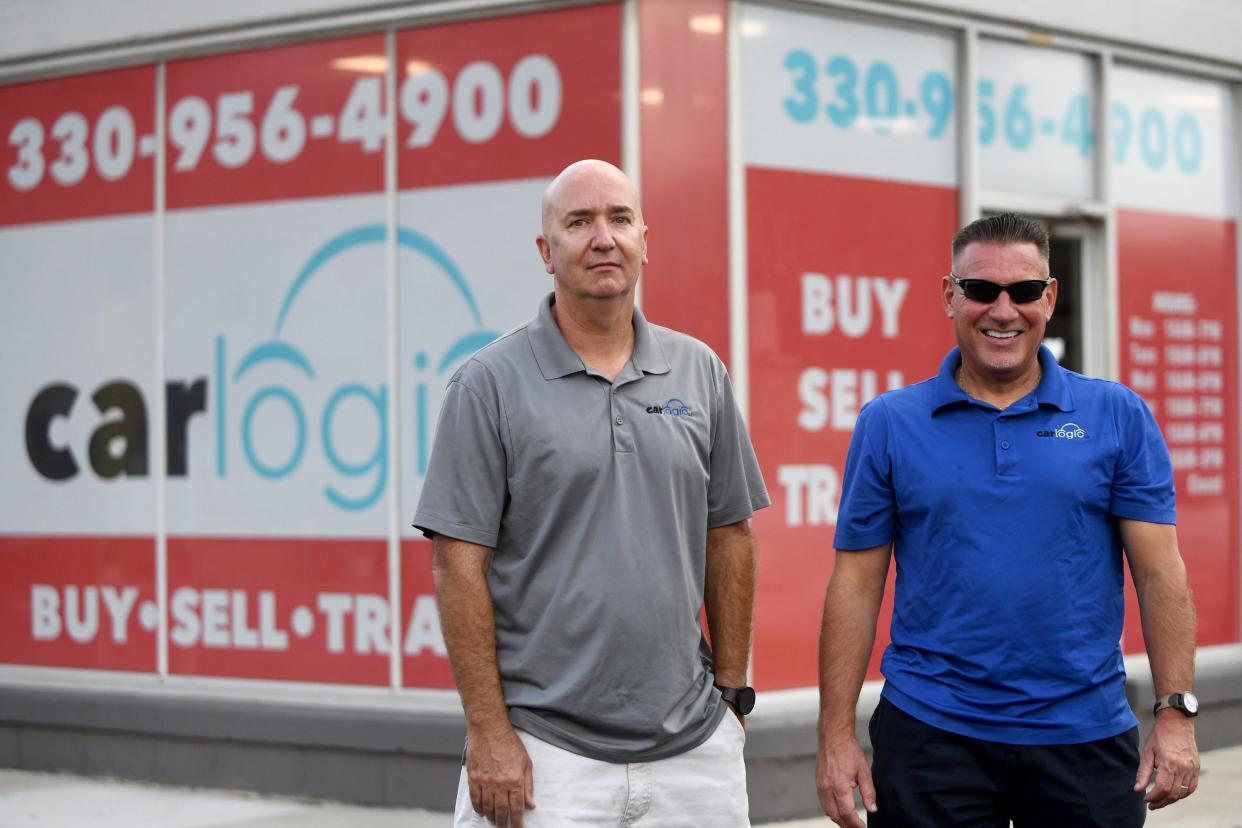 Business partners Ron Winters, left, and Michael France at their used car sales business Car Logic in Canton Township.