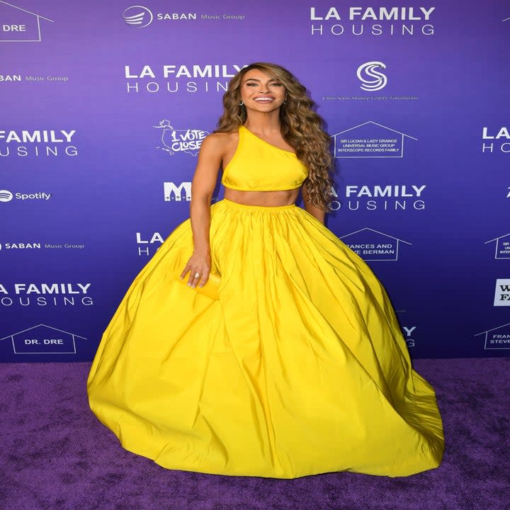 Chrishell in a large puffy skirt and matching crop top for an event