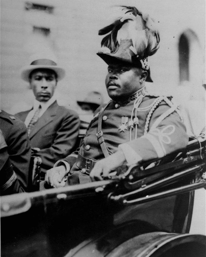 Marcus Garvey is shown in a military uniform as the ‘provisional president of Africa’ during a parade on the opening day of the annual Convention of the Negro Peoples of the World along Lenox Avenue in Harlem, New York, in August 1922.