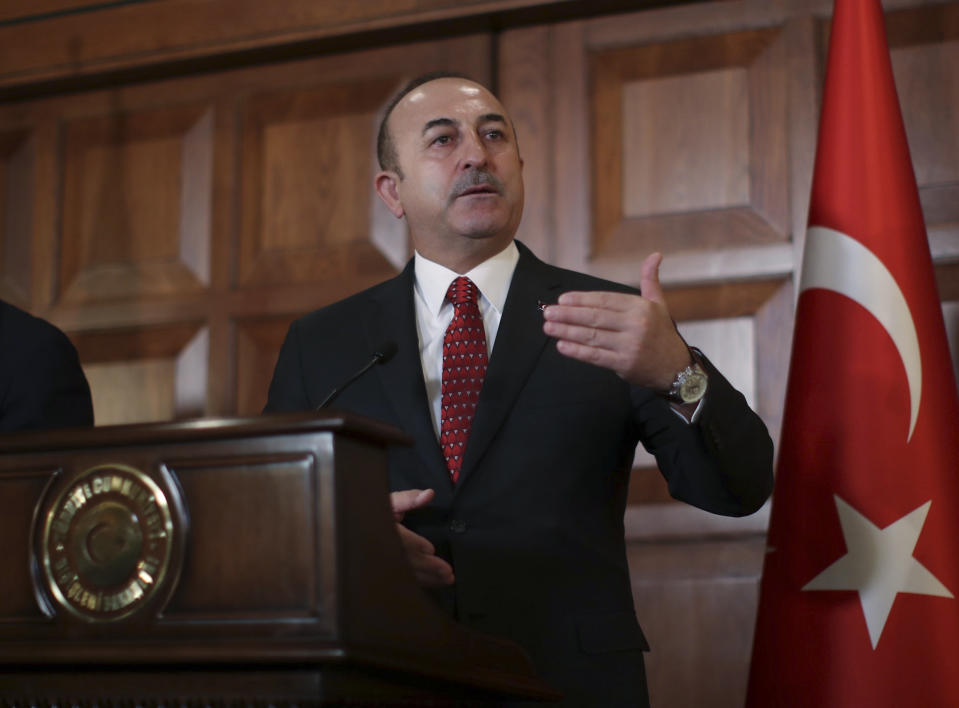Turkey's Foreign Minister Mevlut Cavusoglu, talks to the media during a joint news conference with Luxembourg's Foreign Minister Jean Asselborn following their meeting in Ankara, Turkey, Monday, Jan. 14, 2019. Cavusoglu responded to U.S. President Donald Trump's threat to devastate Turkey economically if it attacks U.S.-backed Kurdish forces in Syria. Cavusoglu also rebuked Trump for issuing the warning via Twitter saying "strategic partners" do not speak to each other through social media. (Cem Ozdel/Turkish Foreign Ministry via AP, Pool)