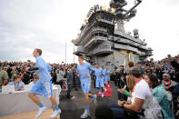 SAN DIEGO, CA - NOVEMBER 11: The North Carolina Tar Heels run out to the court before taking on the Michigan State Spartans during the NCAA men's college basketball Carrier Classic aboard the flight deck of the USS Carl Vinson on November 11, 2011 in San Diego, California. (Photo by Harry How/Getty Images)