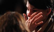 NEWTOWN, CT - DECEMBER 16: A mourner cries before U.S. President Barack Obama speaks at an interfaith vigil for the shooting victims from Sandy Hook Elementary School on December 16, 2012 at Newtown High School in Newtown, Connecticut. Twenty-six people were shot dead, including twenty children, after a gunman identified as Adam Lanza opened fire at Sandy Hook Elementary School. Lanza also reportedly had committed suicide at the scene. A 28th person, believed to be Nancy Lanza, found dead in a house in town, was also believed to have been shot by Adam Lanza. (Photo by Olivier Douliery-Pool/Getty Images)