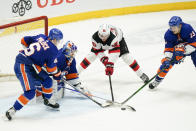 New York Islanders' Ryan Pulock (6) Mathew Barzal (13) and goaltender Ilya Sorokin (30) defend the net from New Jersey Devils' Jack Hughes (86) during the third period of an NHL hockey game Saturday, May 8, 2021, in Uniondale, N.Y. The Islanders won 5-1. (AP Photo/Frank Franklin II)