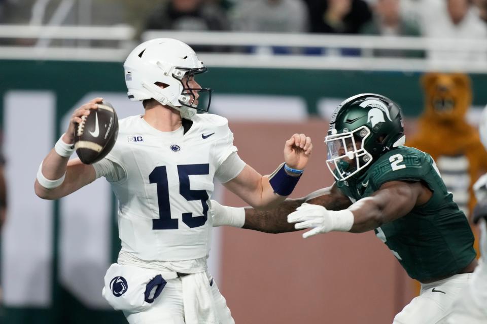 Penn State quarterback Drew Allar is pressured by Michigan State defensive lineman Khris Bogle during the first half on Friday, Nov. 24, 2023, at Ford Field.