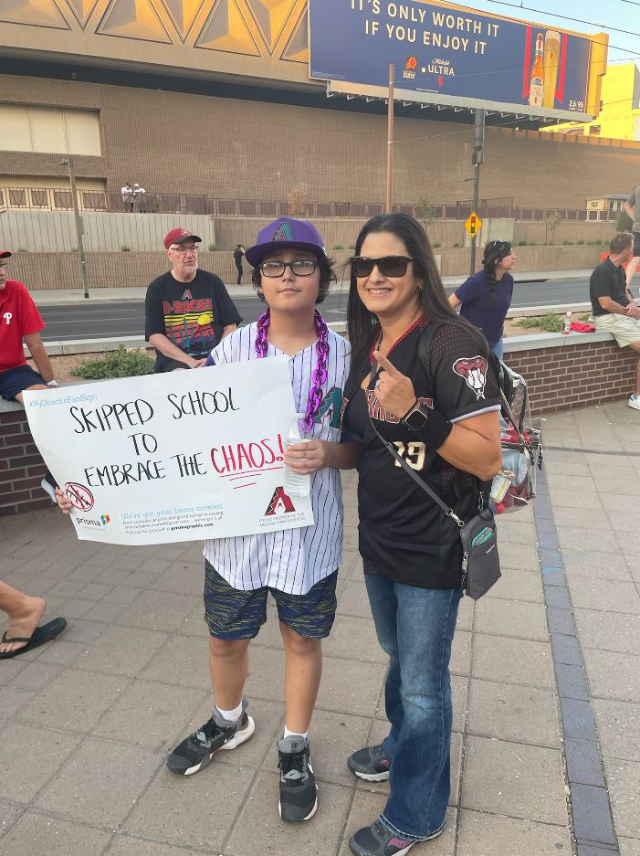 Linda Huyzar McEvoy and her son Christopher pose for a photo after Diamondbacks beat the Phillies in Game 3 on Oct. 19, 2023.