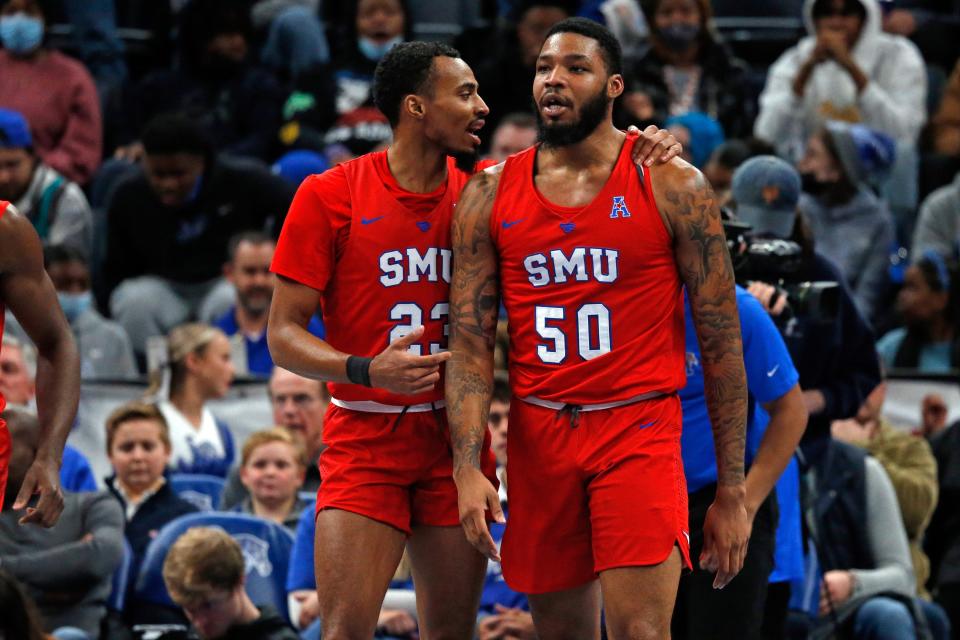 SMU guard Michael Weathers (23) talks with forward Marcus Weathers (50) after a foul during the first half against the Memphis Tigers at FedExForum.