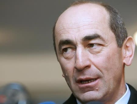 Armenia's President Robert Kocharyan speaks to the media after casting his ballot at a polling station in Yerevan February 19, 2008. REUTERS/David Mdzinarishvili/Files