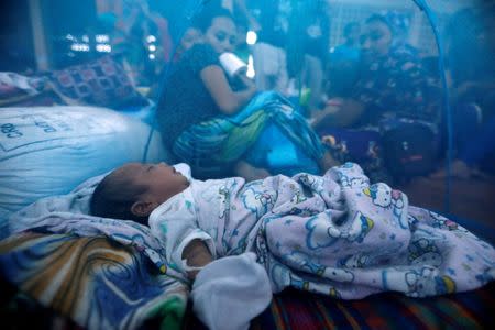 An evacuated newborn sleeps inside a mosquito net at an evacuation center outside Marawi, as government forces continue their assault against insurgents from the Maute group in Marawi, Philippines June 26, 2017. REUTERS/Jorge Silva