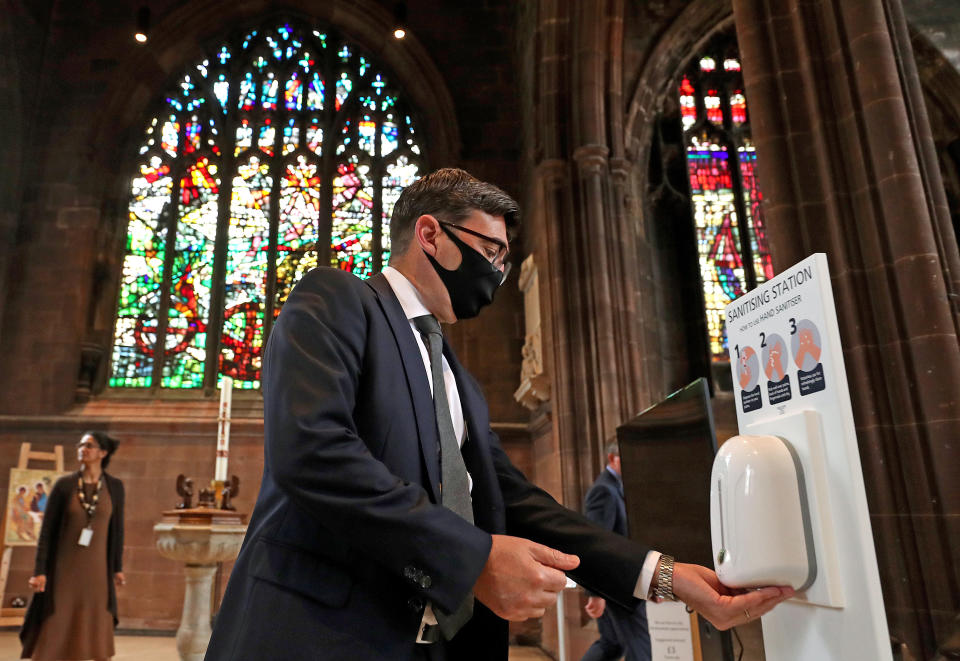Rt. Hon. Andy Burnham, Mayor of Greater Manchester, sanitises his hands before a memorial service for the victims of coronavirus at Manchester Cathedral.