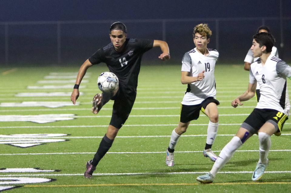 London's Peyton Lawhon tries to control a bouncing ball in the Pirates' Class 4A boys bi-district soccer math against IDEA North Mission at Cabaniss East on Thursday, March 23, 2023. London won 1-0 in a shootout.