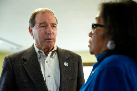 U.S. Sen. Tom Udall (D-NM), visits with Phyliss Young, an organizer of the tribal get-out-the-vote coalition ahead of the 2018 mid-term elections on the Standing Rock Reservation in Fort Yates, North Dakota, U.S. October 26, 2018. REUTERS/Dan Koeck