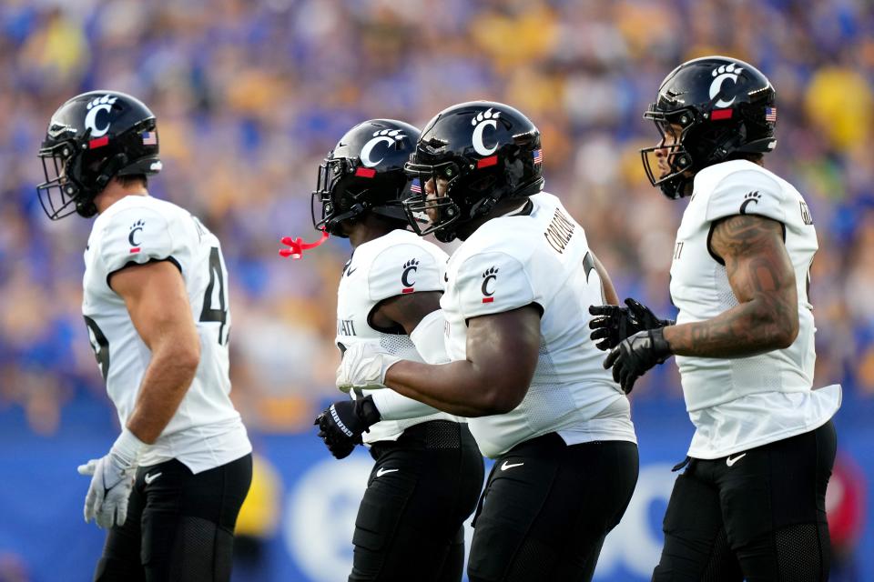 Cincinnati Bearcats defensive lineman Dontay Corleone, center, the Cincinnati Bearcats defense take the field in the first quarter of a college football game between the Cincinnati Bearcats at the Pittsburgh Panthers, Saturday, Sept. 9, 2023, at Acrisure Stadium in Pittsburgh, Pa.