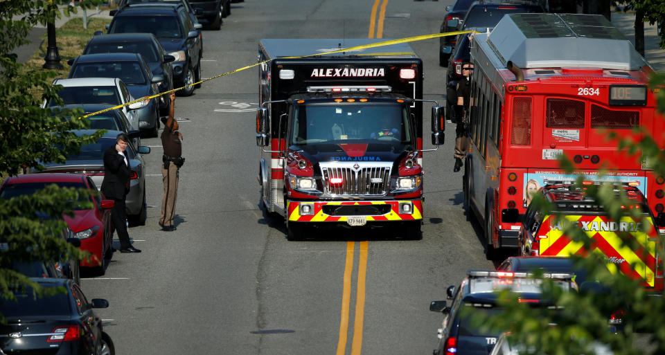 Police make way for an ambulance.