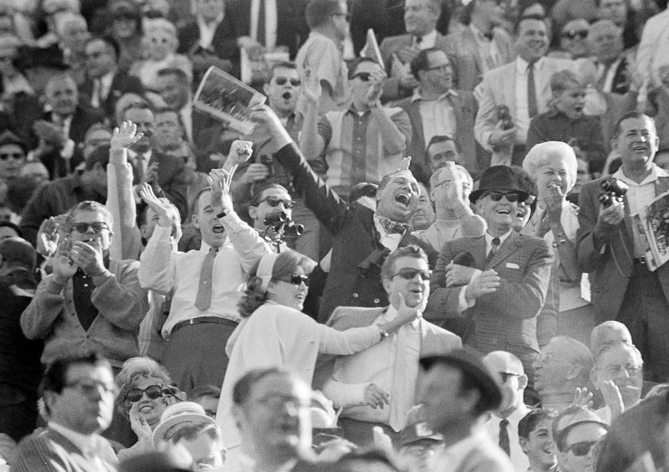 FILE - Green Bay Packers fans react in the stands at the Coliseum in Los Angeles, Jan. 15, 1967, as the National Football League champs played against the Kansas City Chiefs of the American Football League in the Super Bowl game in Los Angeles. (AP Photo, File)