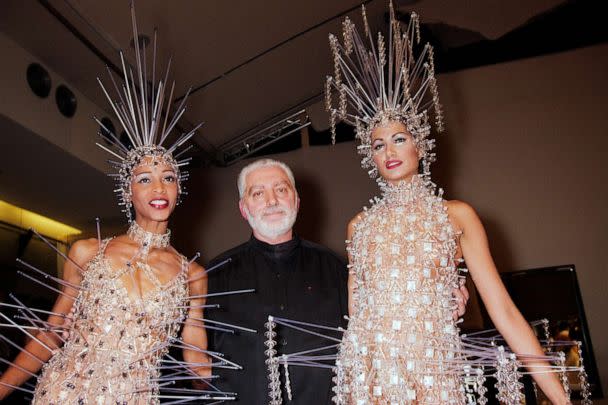 PHOTO: Fashion designer Paco Rabanne poses with models during the Paco Rabanne Haute Couture Spring/Summer 1996 show as part of Paris Fashion Week on Jan. 24, 1996 in Paris. (Stephane Cardinale/Corbis via Getty Images, FILE)