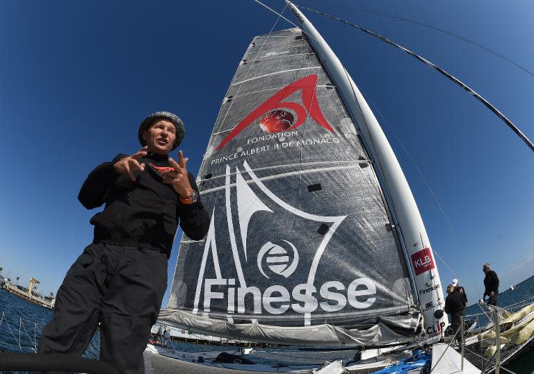 Alain Thébault of France stands next to the "Hydroptère" prior to attempting a record crossing from Los Angeles to Hawaii in under 4.19 days