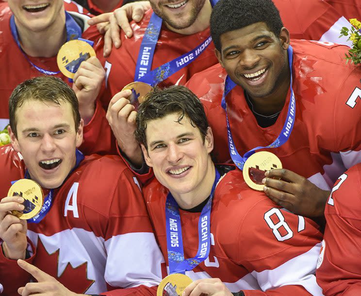 Sidney Crosby and Team Canada celebrate their gold medal win after the Sochi 2014 Winter Olympic Games: Men's hockey, Gold medal game against Sweden. 3rd period action. (Photo by Christopher Morris/Corbis via Getty Images)