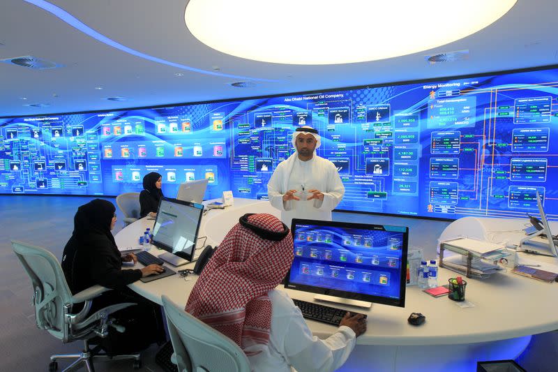 Employees are seen at the Panorama Digital Command Centre at the ADNOC headquarters in Abu Dhabi