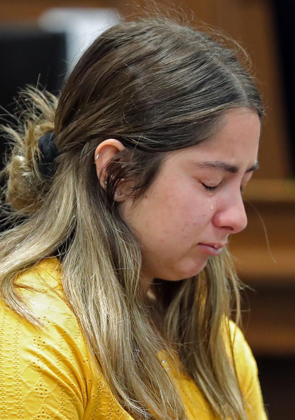 Sydney Powell is overcome with emotion as Assistant Summit County Prosecutor Joe McAleese delivers his opening statement in her murder trial Thursday.