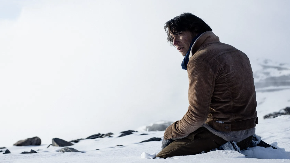 a man sitting on the snow