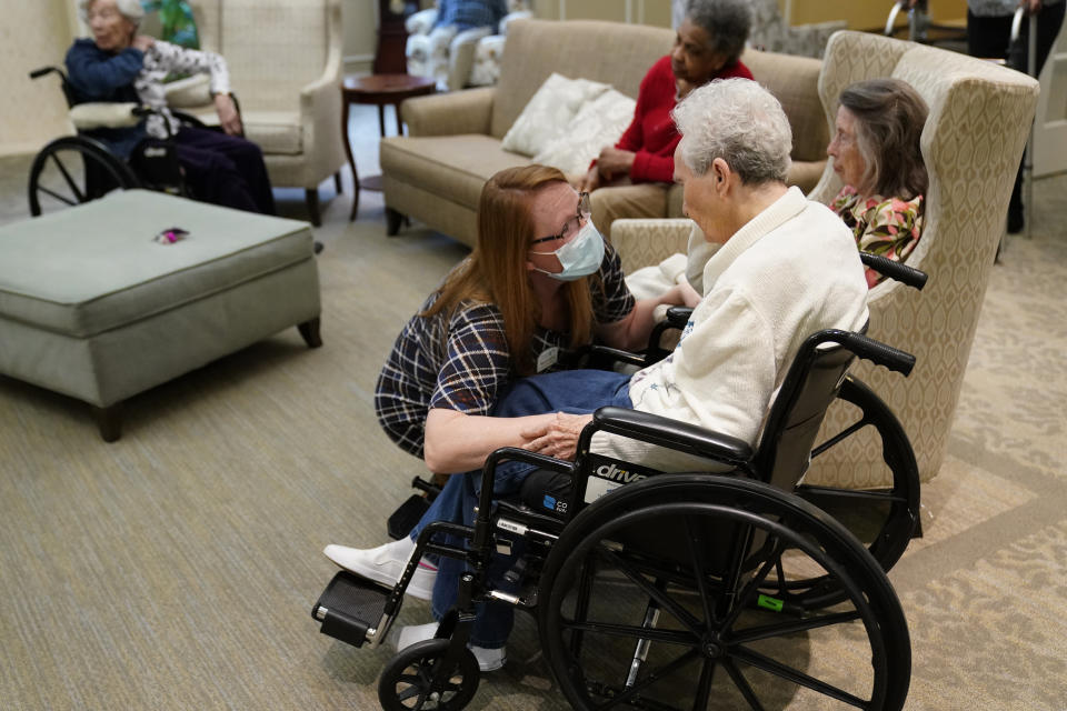 FILE - In this Jan. 11, 2021, file photo, Naomi Adams checks on residents after they received the Pfizer COVID-19 vaccine at Monarch Villa memory care facility in Stockbridge, Ga. The coronavirus vaccines have been rolled out unevenly across the U.S., but some states in the Deep South have had particularly dismal inoculation rates. (AP Photo/John Bazemore, File)