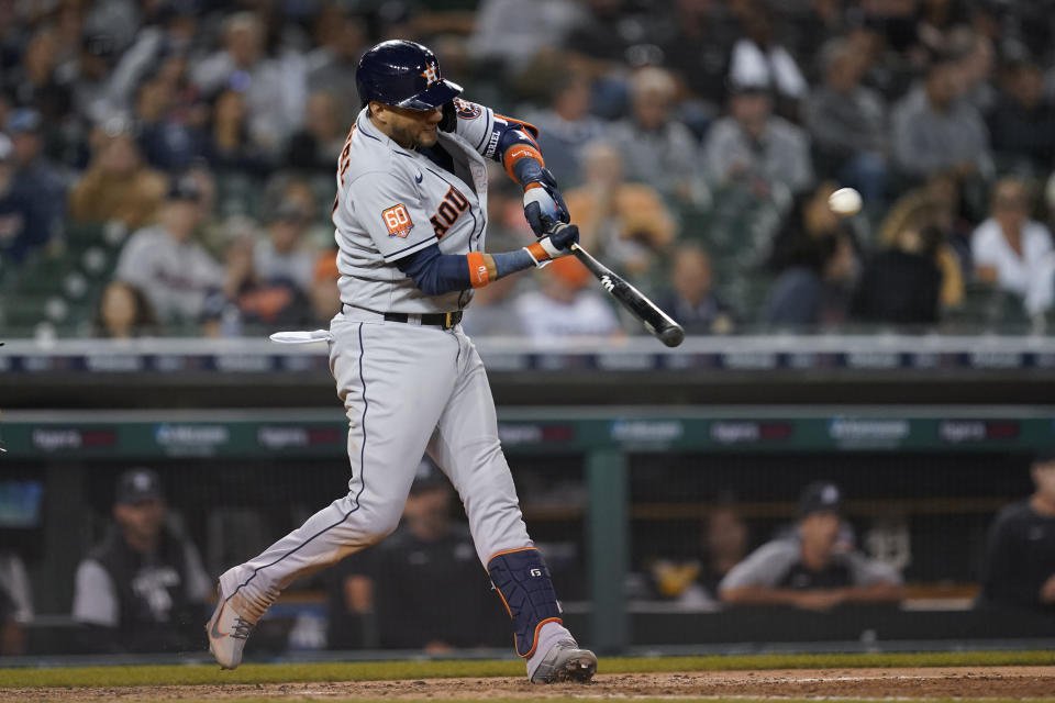 Houston Astros' Yuli Gurriel hits a two-run home run against the Detroit Tigers in the seventh inning of a baseball game in Detroit, Tuesday, Sept. 13, 2022. (AP Photo/Paul Sancya)