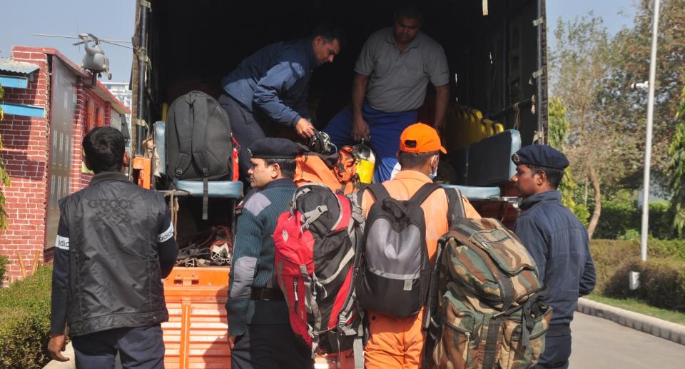 Teams from NDRF's 8th Battalion prepare before heading to Uttarakhand's Chamoli district where a flash flood occurred following a glacial burst on Sunday morning. Photo: Sakib Ali/Hindustan Times via Getty Images