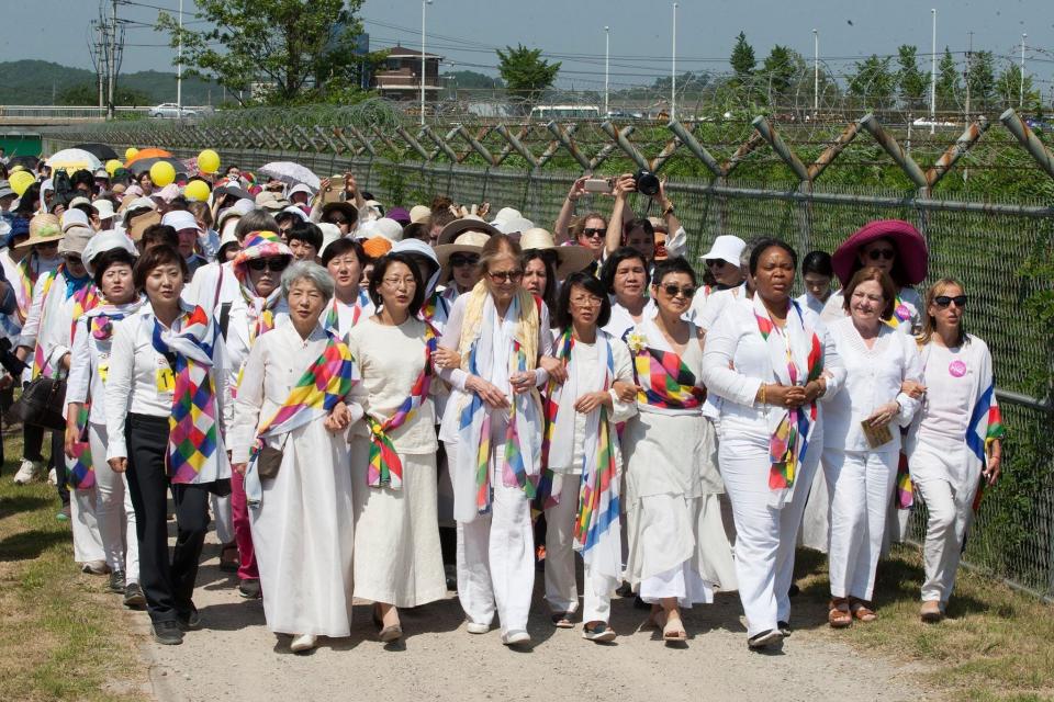 In 2015, Women Cross DMZ crossed the Demilitarized Zone from South Korea to North Korea. In front from left, Vana Kim, Una Kim, feminist icon Gloria Steinem, group leader Christine Ahn, Hyun-Kyung Chung, Nobel Peace laureates Leymah Gbowee and Mairead Maguire, and Medea Benjamin.