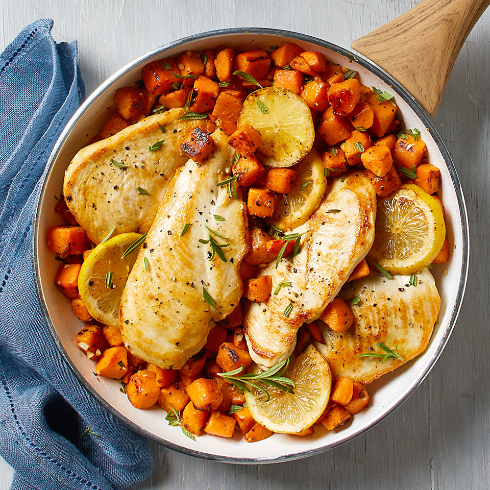 <p>Chicken and sweet potatoes unite with the delicious taste of rosemary in this easy, one-skillet meal. Because we use parcooked and unseasoned sweet potatoes, the cooking time is much shorter--making this recipe perfect for weeknight cooking. <a href="https://www.eatingwell.com/recipe/266576/rosemary-chicken-with-sweet-potatoes/" rel="nofollow noopener" target="_blank" data-ylk="slk:View Recipe;elm:context_link;itc:0;sec:content-canvas" class="link ">View Recipe</a></p>