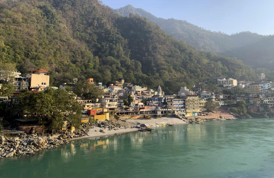 Banks of the River Ganges river wear a deserted look as people stay away as a precautionary measure in Rishikesh, India, after a portion of Nanda Devi glacier broke off in Tapovan area of the northern state of Uttarakhand, Sunday, Feb.7, 2021. Indian authorities launched a search operation Sunday after part of the mountain glacier broke, sending a massive flood of water and debris slamming into two dams and damaging a number of homes. (AP Photo/Rishabh R. Jain)