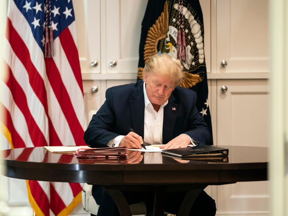 In this image released by the White House, former President Donald Trump works in the Presidential Suite at Walter Reed National Military Medical Center in Bethesda, Maryland on Saturday, October 3, 2020, after testing positive for COVID-19.