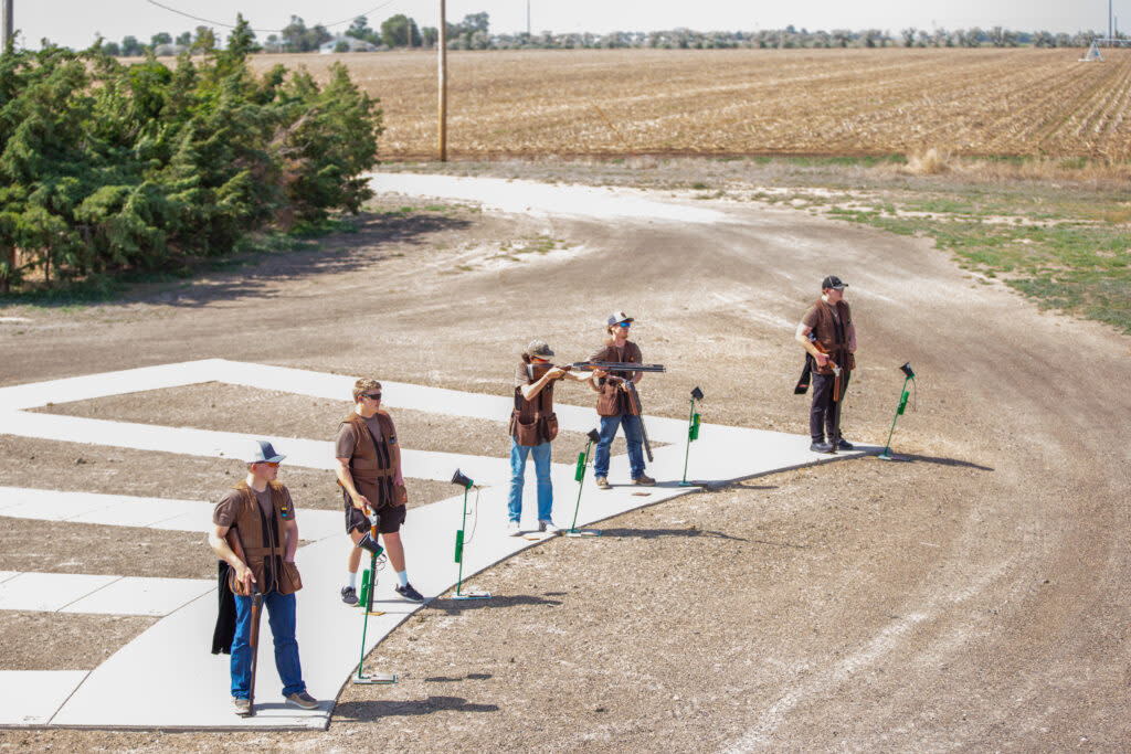 Students with the Garden City High School trap shooting team take to the line for target practice