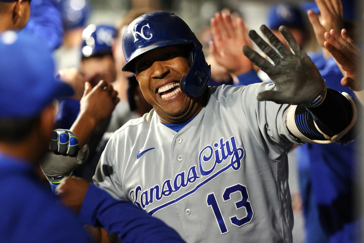 SEATTLE, WASHINGTON - AUGUST 27: Salvador Perez #13 of the Kansas City Royals celebrates with teammates in the dugout after hitting a grand slam to tie the game 5-5 against the Seattle Mariners in the fifth inning at T-Mobile Park on August 27, 2021 in Seattle, Washington. (Photo by Abbie Parr/Getty Images)
