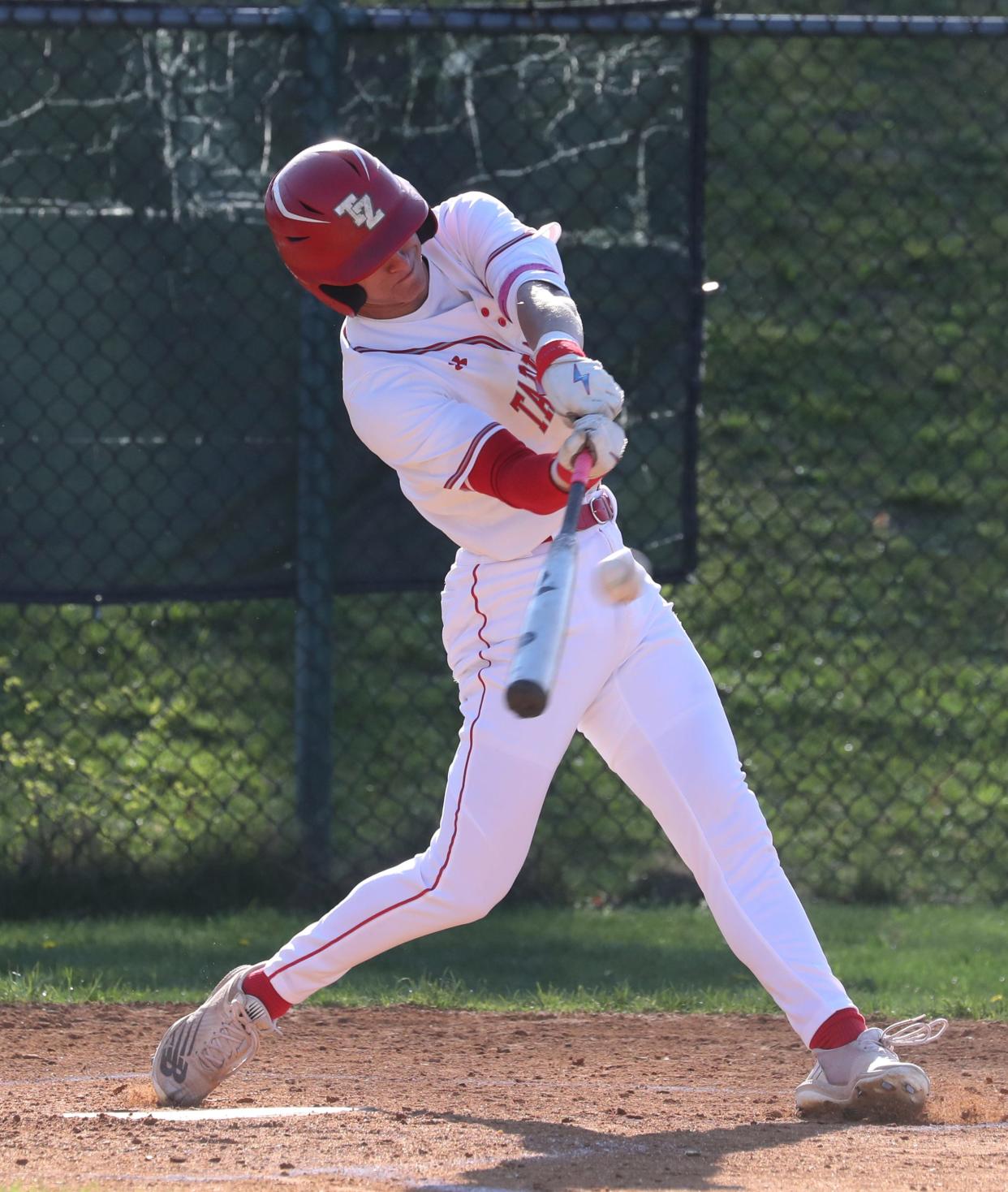 Tappan Zee's Ben Fishel hits a triple during a game with Pearl River at Tappan Zee April 18, 2023. Tappan Zee won 10-2