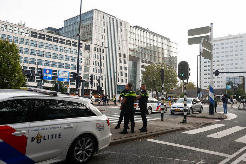 Police officers secure the area after Dutch police arrested a suspect after a shooting in Rotterdam