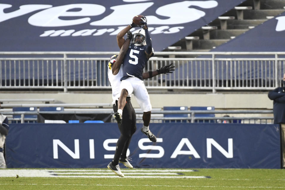 Penn State wide receiver Jahan Dotson (5) catches a second-quarter touchdown pass in front of Maryland defensive back Jakorian Bennett (2) during an NCAA college football game in State College, Pa., Saturday, Nov. 7, 2020. (AP Photo/Barry Reeger)