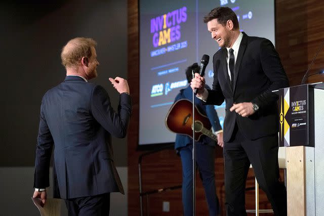 <p>Ethan Cairns/The Canadian Press via AP</p> Prince Harry and Michael Bublé at the Invictus Vancouver Whistler 2025 One Year To Go gala at Vancouver Convention Centre on February 16.