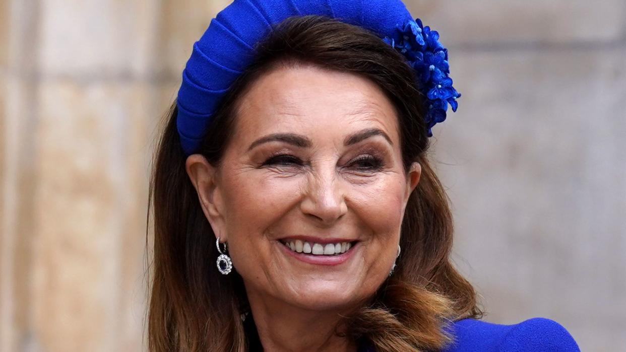 Carole smiling in a cobalt blue dress