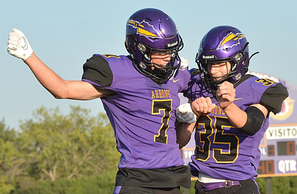 Watertown's Mitch Olson (7) and Owen Spartz bump into each other during the announcement of starting lineups prior to the team's season-opening high school football game against Brookings on Friday, Aug. 25, 2023 at Watertown Stadium.