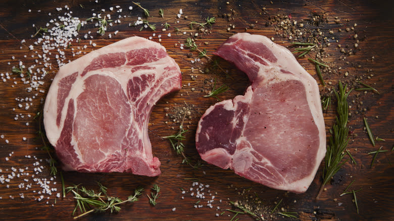 pork chops laid out on cutting board